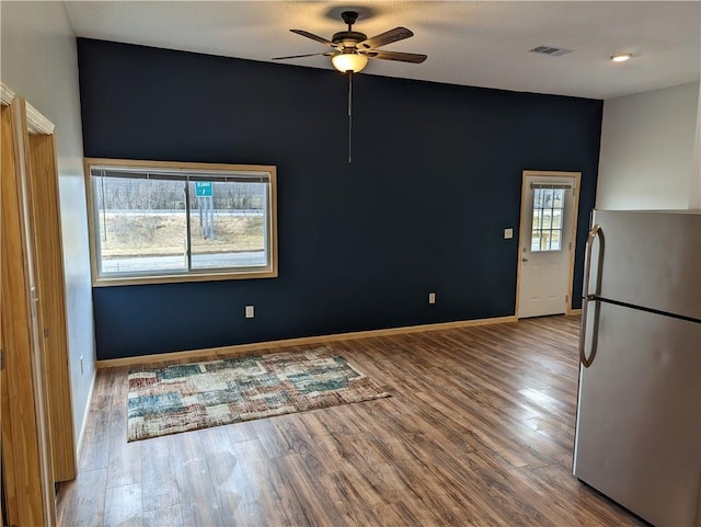 700 W 40th Hwy, Sweet Springs, MO 65351 - interior space with visible vents, baseboards, a ceiling fan, and wood finished floors