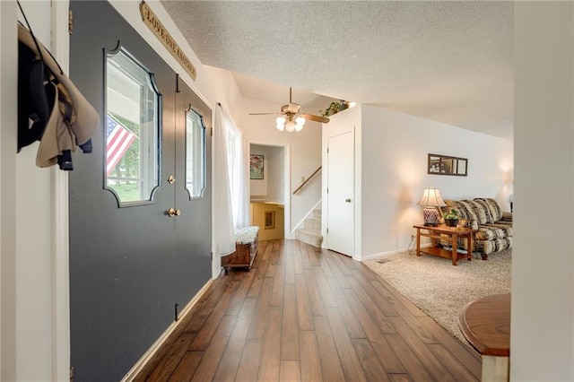 763 J Hwy, Peculiar, MO 64078 - corridor with a textured ceiling, stairway, hardwood / wood-style flooring, and baseboards