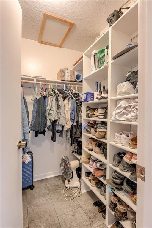 763 J Hwy, Peculiar, MO 64078 - walk in closet featuring attic access