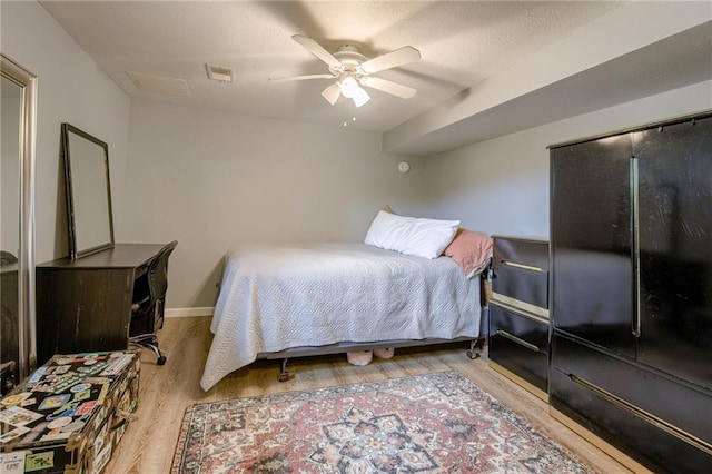 763 J Hwy, Peculiar, MO 64078 - bedroom featuring wood finished floors, ceiling fan, and baseboards