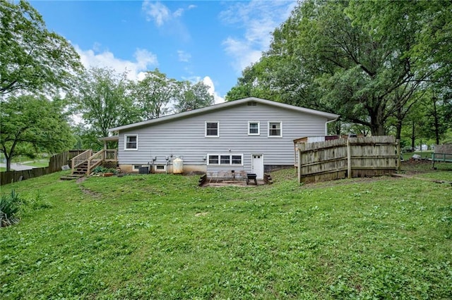 763 J Hwy, Peculiar, MO 64078 - rear view of house featuring stairway and a wooden deck