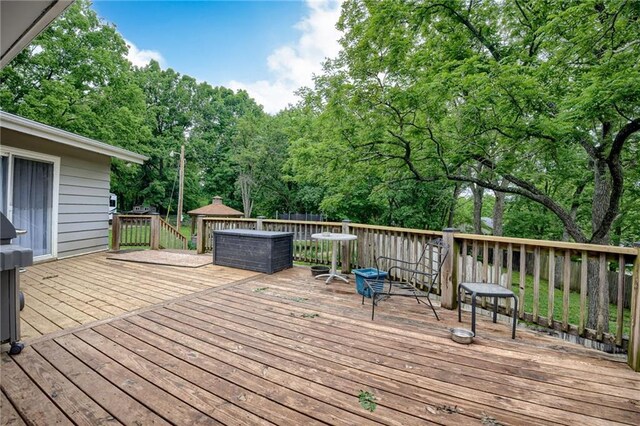 763 J Hwy, Peculiar, MO 64078 - wooden deck with view of wooded area