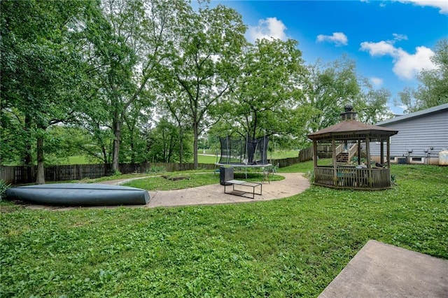 763 J Hwy, Peculiar, MO 64078 - view of yard with a trampoline, a gazebo, and a patio area