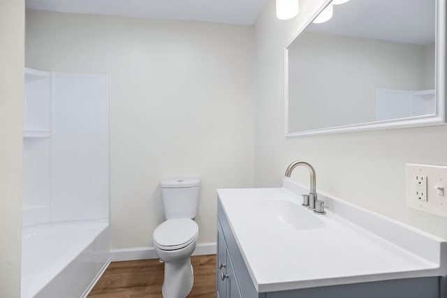 2308 NW 53rd Ter, Kansas City, MO 64151 - full bath featuring wood finished floors, vanity, toilet, and baseboards