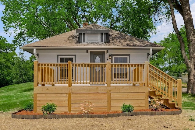 2308 NW 53rd Ter, Kansas City, MO 64151 - back of house featuring a shingled roof, stairway, a chimney, and a wooden deck