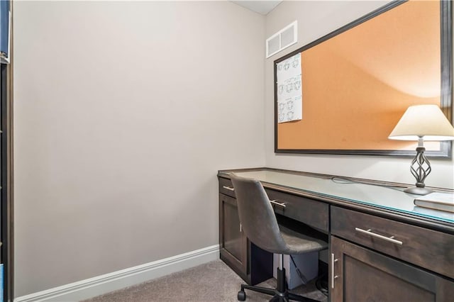 home office with visible vents, baseboards, and carpet flooring
