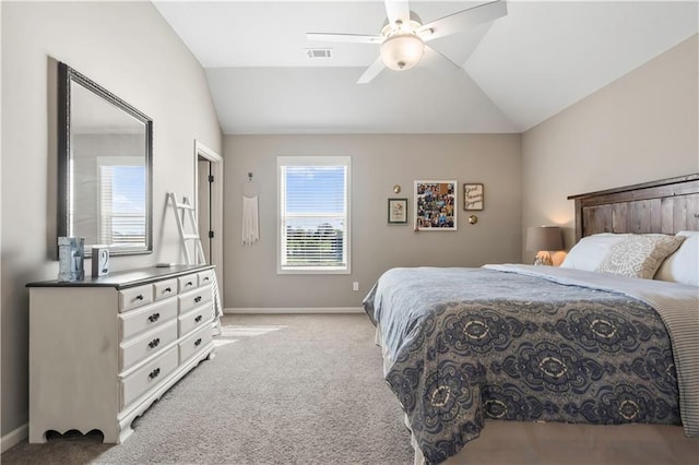 bedroom featuring a ceiling fan, visible vents, light carpet, lofted ceiling, and baseboards