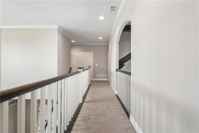 corridor with visible vents, baseboards, recessed lighting, and light carpet