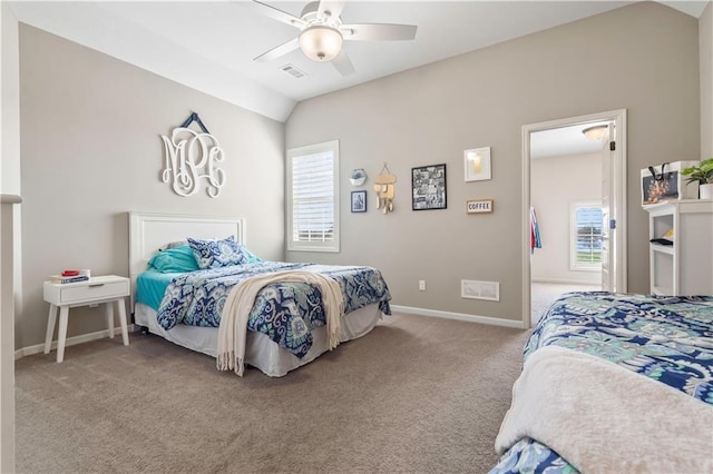 bedroom featuring carpet floors, multiple windows, vaulted ceiling, and visible vents