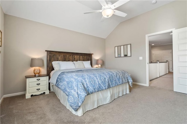 carpeted bedroom with baseboards, ceiling fan, and vaulted ceiling