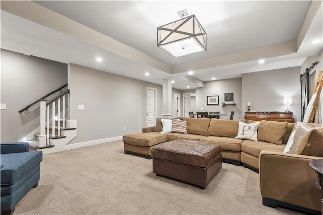 living room with visible vents, baseboards, recessed lighting, stairs, and light colored carpet