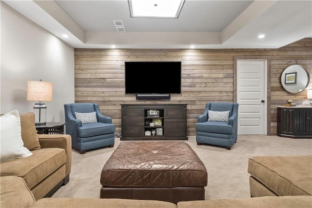 living room with recessed lighting, wooden walls, visible vents, and carpet floors