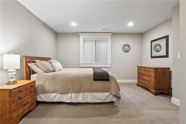 bedroom with recessed lighting, visible vents, light colored carpet, and baseboards