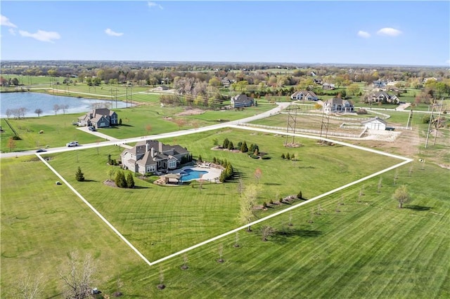 bird's eye view with a water view and a rural view