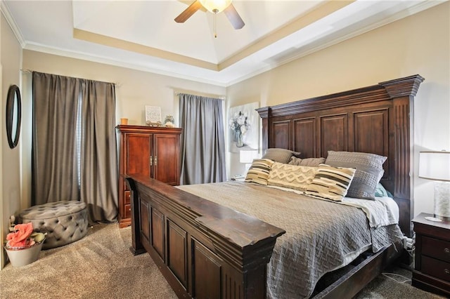 bedroom featuring carpet flooring, a raised ceiling, ceiling fan, and ornamental molding