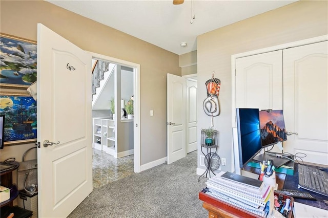 office space featuring baseboards and carpet flooring