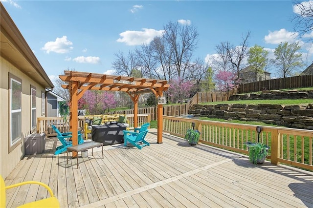 deck with a fenced backyard and a pergola