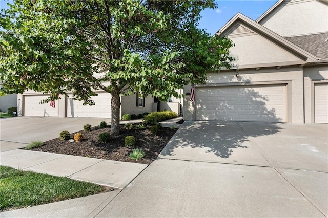 2118 NE 107th Ter, Kansas City, MO 64155 - view of property hidden behind natural elements featuring concrete driveway, roof with shingles, stucco siding, and a garage