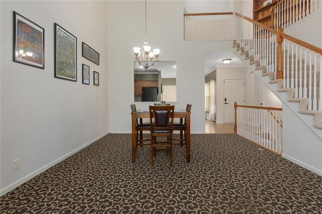 2118 NE 107th Ter, Kansas City, MO 64155 - carpeted dining space with stairs, a towering ceiling, baseboards, and an inviting chandelier