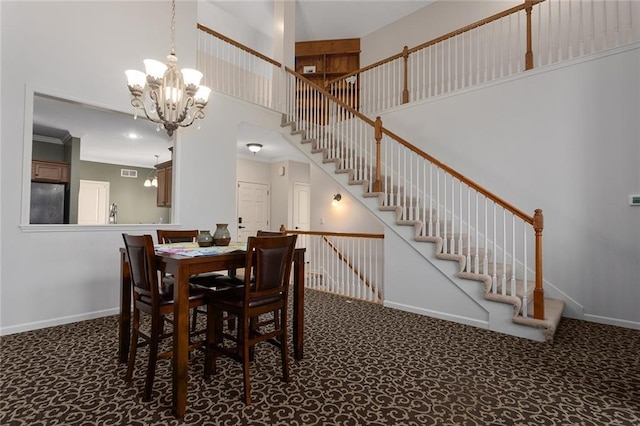 2118 NE 107th Ter, Kansas City, MO 64155 - dining room featuring a towering ceiling, carpet flooring, stairs, a notable chandelier, and baseboards
