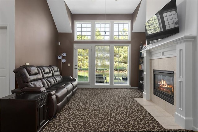 2118 NE 107th Ter, Kansas City, MO 64155 - living room with a high ceiling, light carpet, and a fireplace