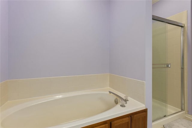 2118 NE 107th Ter, Kansas City, MO 64155 - bathroom featuring a shower stall and a bath