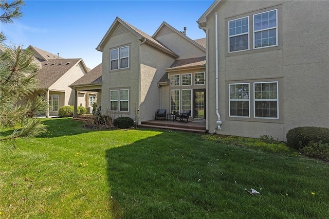 2118 NE 107th Ter, Kansas City, MO 64155 - back of house with a yard and stucco siding