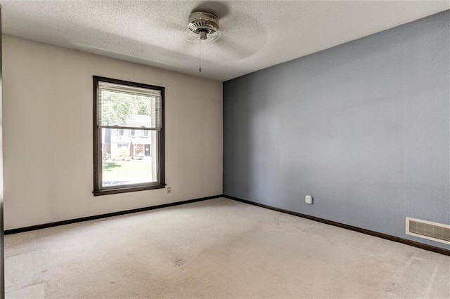 12253 W 104th St, Lenexa, KS 66215 - carpeted empty room with ceiling fan, a textured ceiling, and baseboards