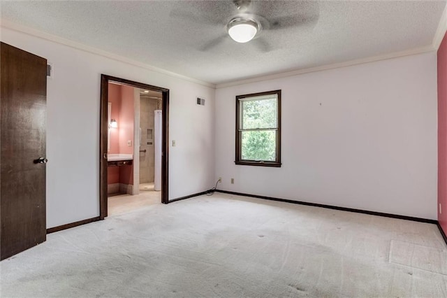 12253 W 104th St, Lenexa, KS 66215 - unfurnished bedroom with crown molding, light carpet, a textured ceiling, baseboards, and ensuite bathroom