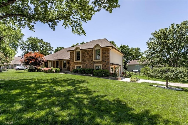 12253 W 104th St, Lenexa, KS 66215 - split level home featuring a front lawn and stone siding