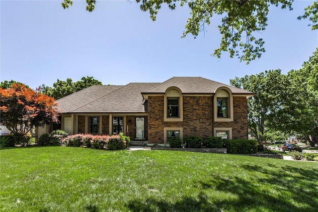 12253 W 104th St, Lenexa, KS 66215 - view of front of home featuring a front yard and brick siding