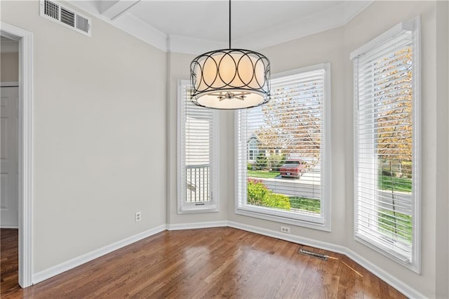 12314 England St, Overland Park, KS 66213 - unfurnished dining area with visible vents, baseboards, a notable chandelier, and wood finished floors