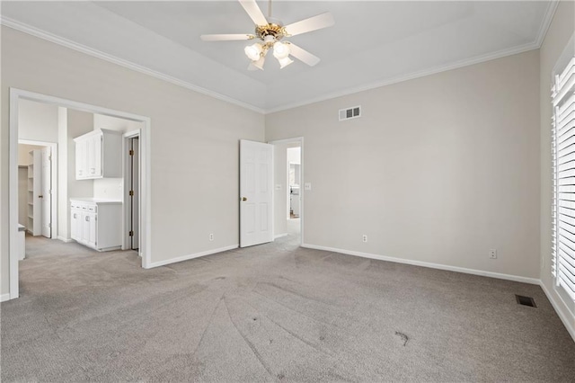 12314 England St, Overland Park, KS 66213 - unfurnished bedroom featuring crown molding, visible vents, and carpet flooring