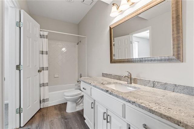 12314 England St, Overland Park, KS 66213 - bathroom with toilet, shower / tub combo with curtain, vanity, and wood finished floors