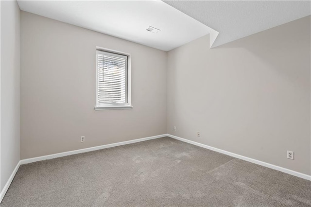 12314 England St, Overland Park, KS 66213 - spare room featuring carpet flooring, baseboards, and visible vents