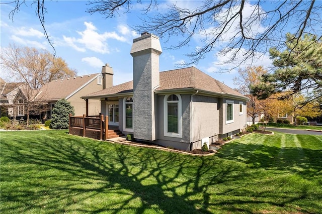 12314 England St, Overland Park, KS 66213 - rear view of property with a wooden deck, stucco siding, a lawn, and a chimney