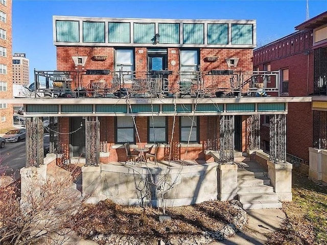 220-222 W Armour Blvd, Kansas City, MO 64111 - back of house featuring brick siding