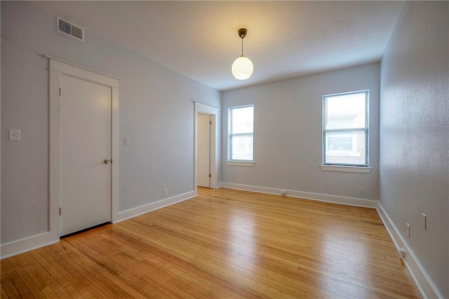 220-222 W Armour Blvd, Kansas City, MO 64111 - unfurnished room featuring baseboards, visible vents, and light wood-style floors