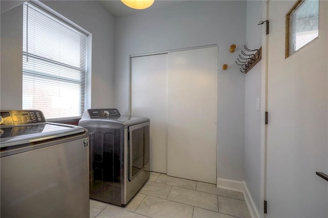 220-222 W Armour Blvd, Kansas City, MO 64111 - washroom featuring washer and dryer, laundry area, and light tile patterned floors