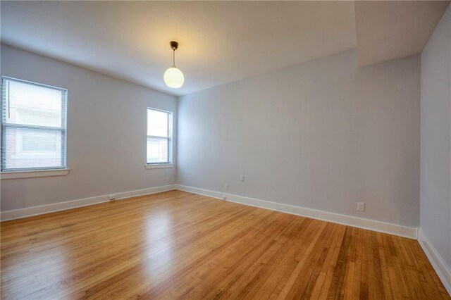 220-222 W Armour Blvd, Kansas City, MO 64111 - empty room featuring baseboards and light wood-style flooring