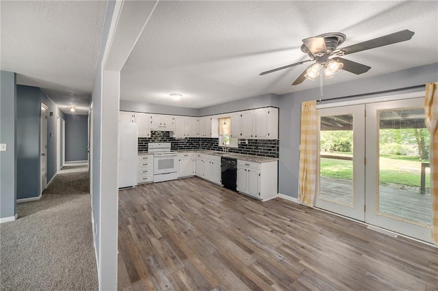 kitchen featuring white appliances, white cabinets, baseboards, ceiling fan, and tasteful backsplash