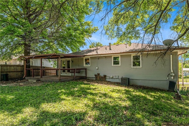 back of property with a wooden deck and central air condition unit
