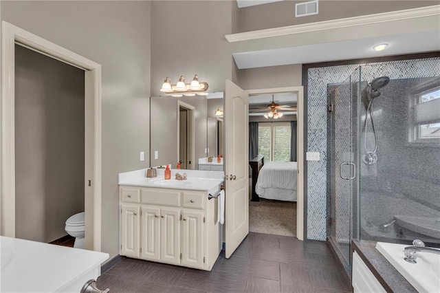 bathroom with a ceiling fan, visible vents, a shower stall, and vanity