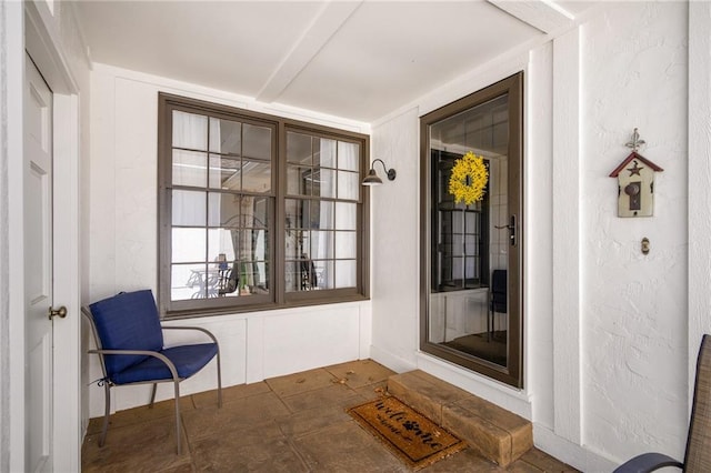 view of exterior entry featuring a porch