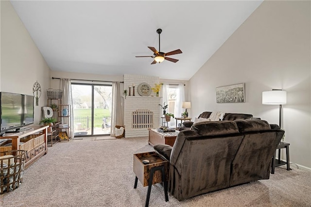 living room with high vaulted ceiling, a fireplace, ceiling fan, and carpet floors