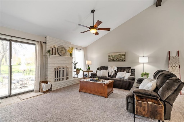 living room featuring light carpet, a healthy amount of sunlight, ceiling fan, and high vaulted ceiling
