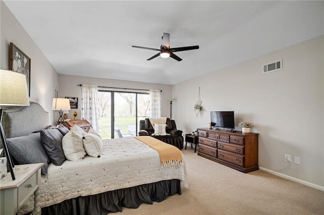 carpeted bedroom with visible vents, ceiling fan, and baseboards