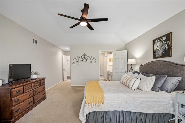 bedroom featuring baseboards, light carpet, connected bathroom, visible vents, and ceiling fan