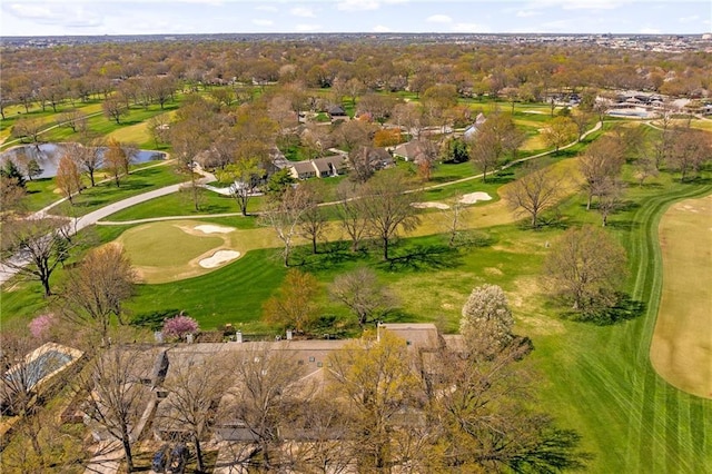 bird's eye view with view of golf course and a water view