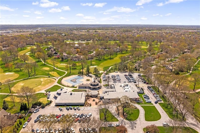 birds eye view of property with view of golf course